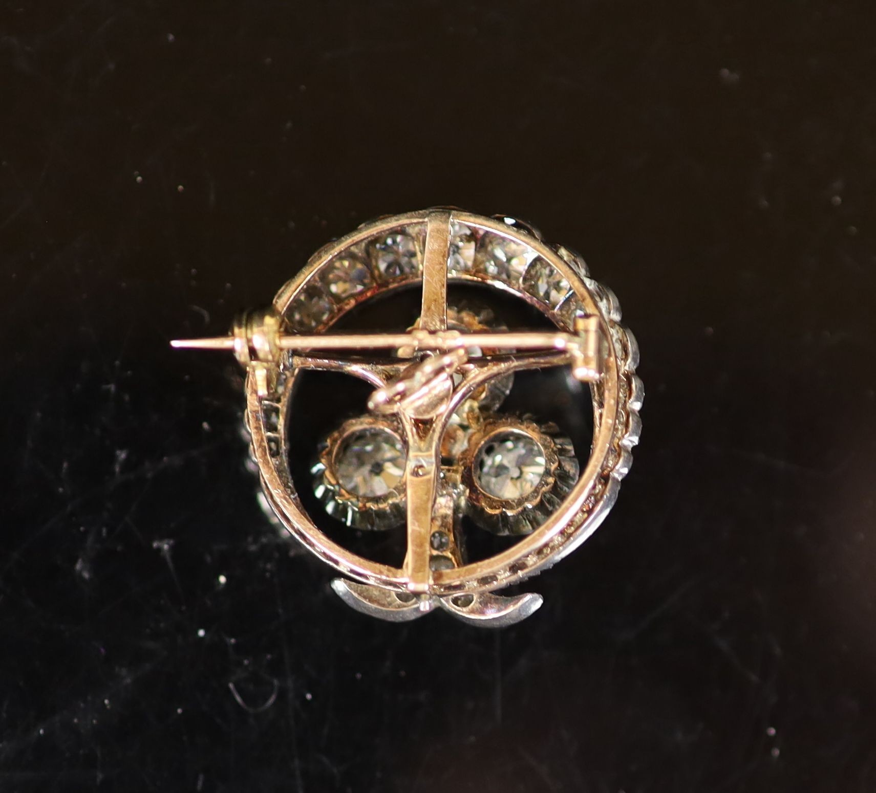 A late Victorian gold, silver and diamond cluster set 'crescent and clover' circular brooch